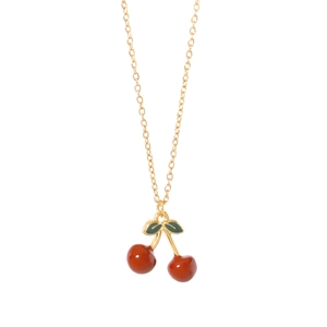 Golden chain necklace featuring a polished red cherry pendant with green enamel leaves