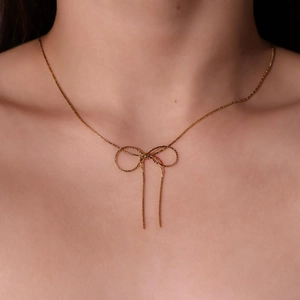 Elegant gold bow necklace for women featuring a minimalist titanium steel chain design