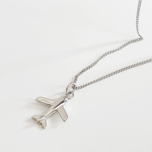 Elegant 925 sterling silver airplane pendant necklace on a minimalist white background