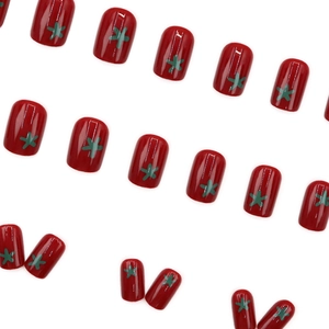 Short red press-on nails featuring cute tomato and star patterns in a glossy finish