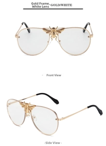 Macro detail of gold metal aviator frames featuring an intricate bee and M engraving