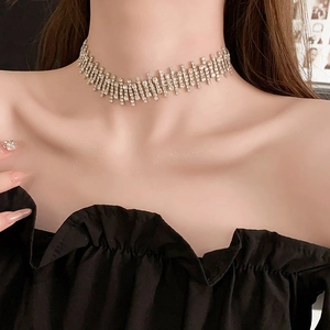 Close-up of sparkling rhinestone choker necklace on model showing elegant diamond texture