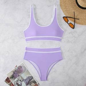 Contrast color bikini set in lavender purple with white stripes on marble background