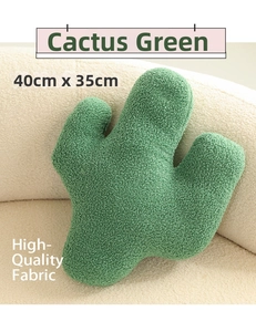 Detail of green cactus plush pillow in textured boucle fabric, 40x35cm on a white sofa