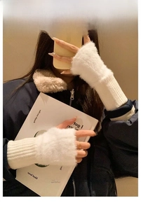 Detailed view of white faux fur fingerless gloves with ribbed cuffs in a daily work scene