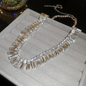 Detailed macro view of silver baguette cut crystal choker with brilliant sparkle effect