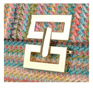 Detailed macro view of colorful raffia woven texture with a gold geometric metal clasp