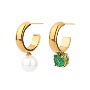 Detailed view of asymmetric gold C-shaped earrings with a white pearl and green gemstone