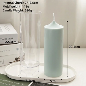 Cylindrical church style candle mold with finished blue wax pillar on white tray