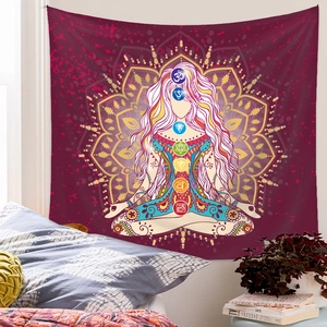 Detailed view of the red mandala seven chakra tapestry hanging in a cozy bedroom setting