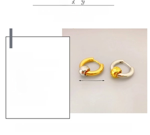 Detailed view of 18K gold plated brass hoop earrings with quilted pattern texture