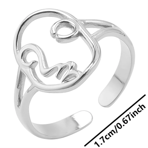 Detail showing adjustable silver abstract face ring with internal diameter of 1.7cm