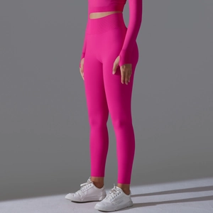 Detailed side view of seamless rose pink high waist yoga pants and long sleeve top