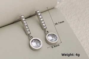 Detailed view of silver zircon earrings with dimensions 28.7mm height and 4g weight