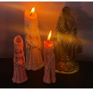 Gothic ghost groom and skeleton bride Halloween candles with dark reaper statue background