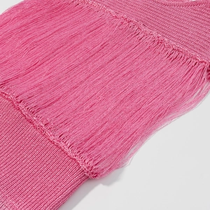 Detailed close-up showing pink knit fabric texture and dense fringe craftsmanship