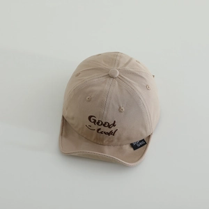 Detail of light khaki baby baseball cap with Good Luck embroidery and soft brim