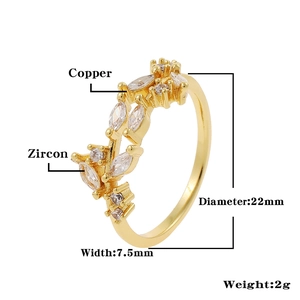 Detailed view of gold crown ring featuring marquise zircon leaves and dimensions