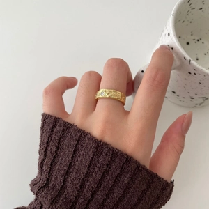 Irregular 925 sterling silver ring with gold hammered texture and a single diamond accent