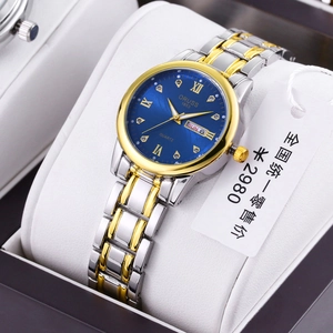 Close-up of ORUSS quartz watch with blue sunray dial and dual calendar in gift box