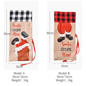 Detail showing red and black plaid burlap wine bottle gift bags with Santa Claus graphics