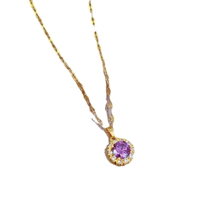 Elegant gold titanium necklace featuring a round purple zircon stone with crystal halo