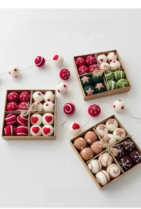 Detailed macro view of colorful wool felt Christmas balls in a rustic kraft paper gift box