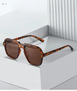 Macro detail of tortoiseshell pilot sunglasses frame texture on geometric display