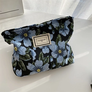 Close-up of vintage floral jacquard fabric bag with Pleasant Time label and leaf patterns