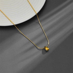 Minimalist gold teardrop pendant necklace with polished finish on sleek chain for women