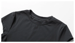 Detailed close-up of the round neckline and stitching on this black athletic yoga T-shirt