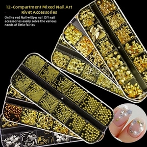 Detailed view of 12-slot nail art set with gold metal studs, stars, and moon charms