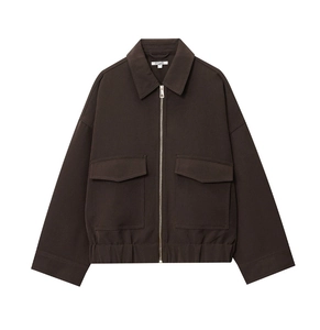 Detail shot of a chocolate brown utility jacket with large pockets and metal zipper
