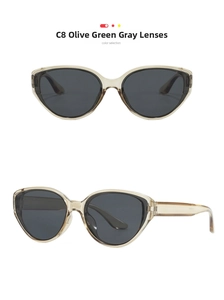 Detail shot of vintage olive green cat-eye sunglasses with dark gray lenses and transparent frames