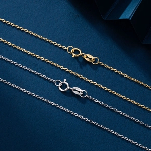 Detail shot of gold and silver S925 sterling silver necklaces showing clasps and S925 hallmarks
