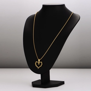 Punk style golden necklace featuring a hollow thorn heart pendant on a black neck model