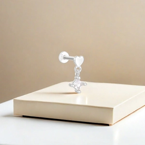 Detailed view of S925 sterling silver heart crown earring with zircon on a display