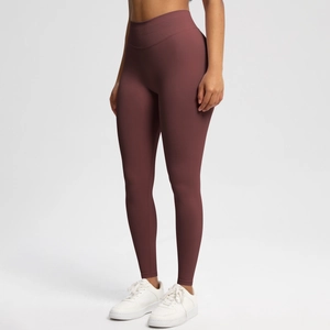 Close-up of seamless burgundy high-waisted yoga leggings with moisture-wicking fabric