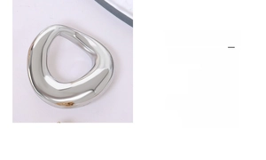 Detail of silver double-loop detachable titanium steel earrings with high-polish finish