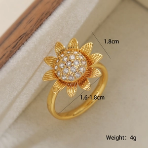 Macro shot of gold-plated sunflower ring with zircon crystals and dimensions text
