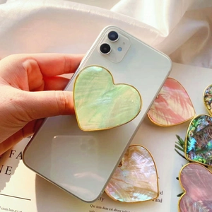 Supporto per cellulare a cuore con trama in madreperla e bordo dorato lucido