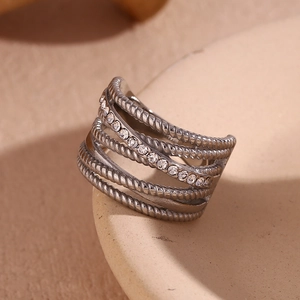 Close-up of silver multilayer twisted rope ring with sparkling rhinestones on display