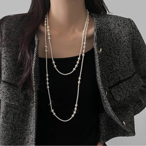French vintage double layer long pearl necklace with geometric charm on grey background