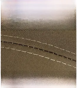 Detailed close-up of double-stitched seams on durable khaki twill fabric baseball cap