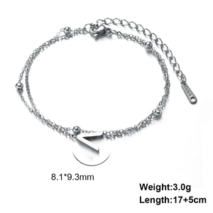 Detail of silver stainless steel double layer chain with letter V pendant and S-STEEL tag
