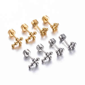 Detail of cross and cluster ball stud earrings in polished gold and silver steel finish