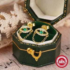 Golden S925 sterling silver evil eye chain drop earrings with sparkling green zircon stones