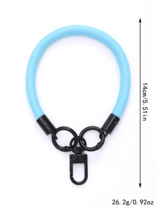 Detail view of a 14cm blue leather wrist strap with black metal clips and weight info