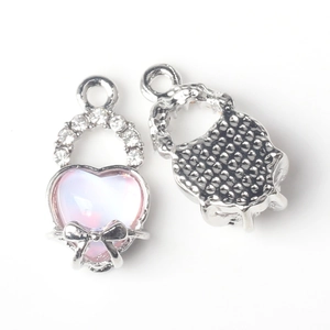 Detail of heart pendant with pink gradient stone and zircon inlay for DIY jewelry