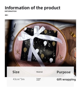 Detail of 43cmx3m black gift wrapping paper with gold balloon pattern on ceramic plate